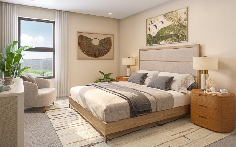 a bedroom with a bed and a chair and a window