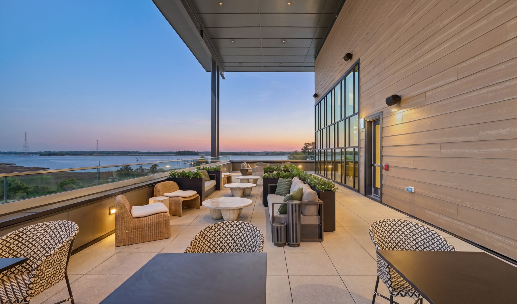 a spacious outdoor lounge overlooking the ocean
