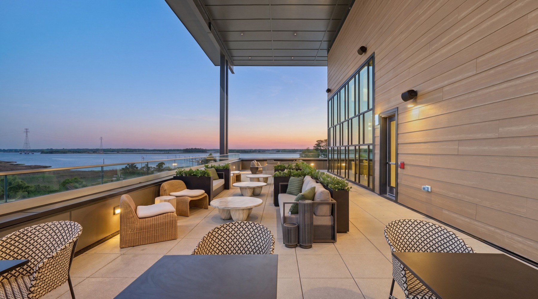 a spacious outdoor lounge overlooking the ocean