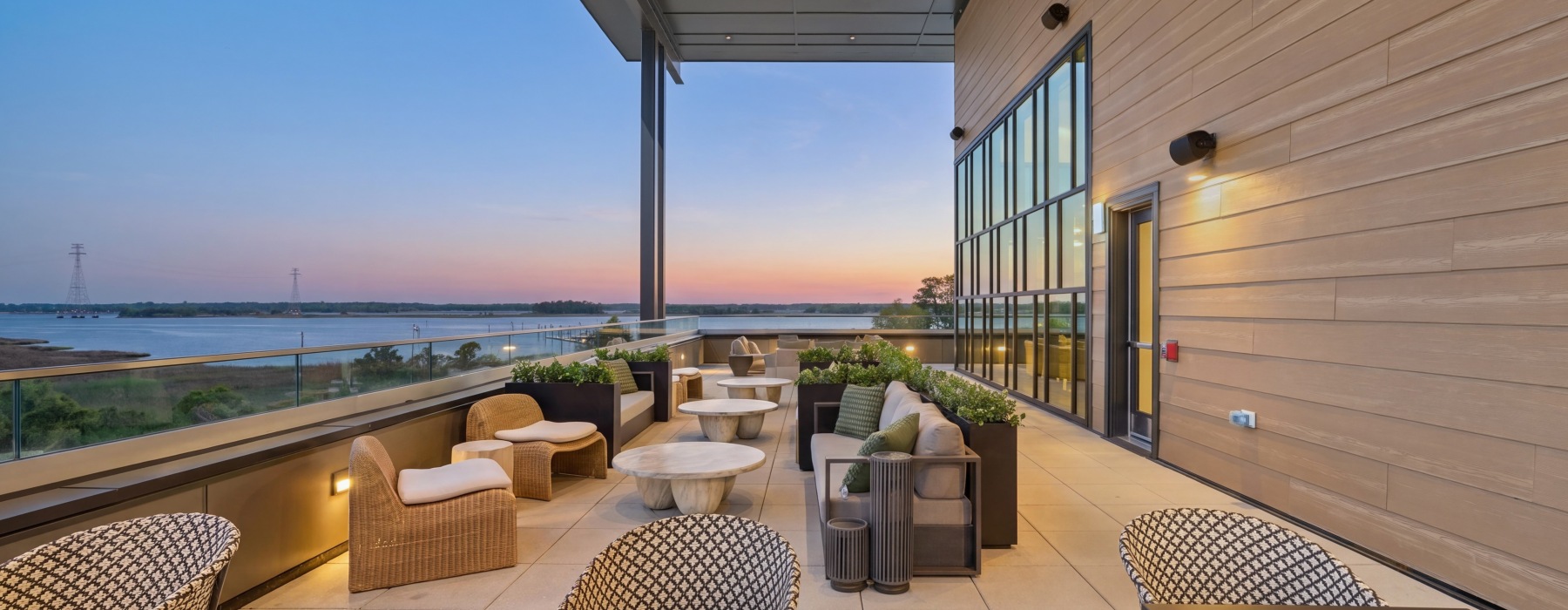 a spacious outdoor lounge overlooking the ocean